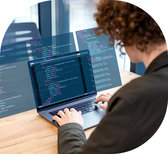Software developer working on HTML and CSS code on a laptop with floating code interfaces, focused on front-end development in a tech office.