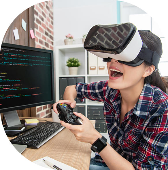 Young woman using VR headset and controller at gaming and coding desk." Let me know if you want variants focused on either VR, coding, or female gamers!